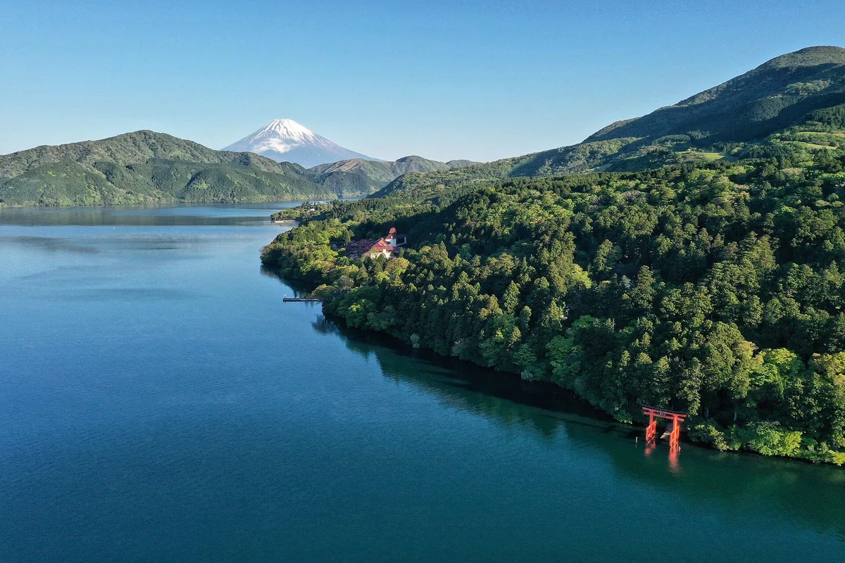 Lake Ashi, Mount Fuji and Hakone Shrine's lakeside torii seen together from across the water