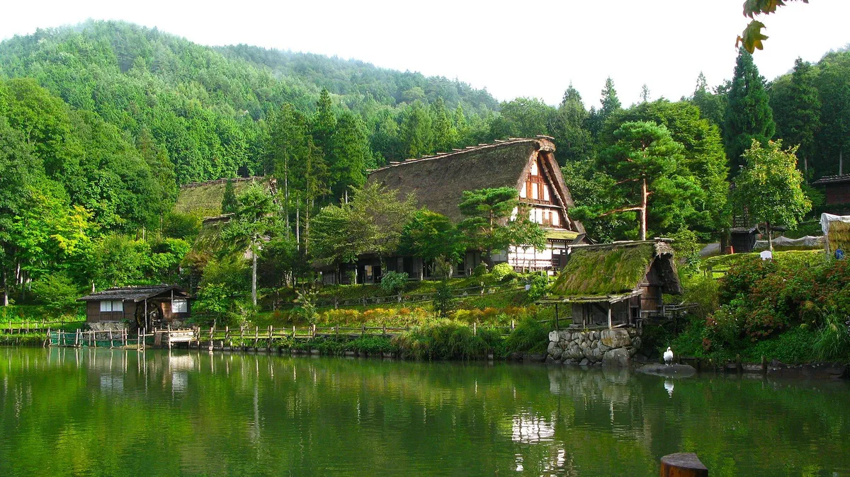 Green summer landscape and thatched buildings at Hida Folk Village