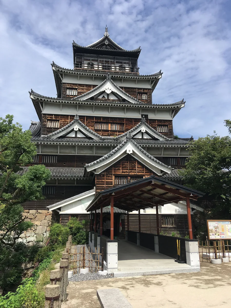 Vertical view of Hiroshima Castle keep rising above the stone base