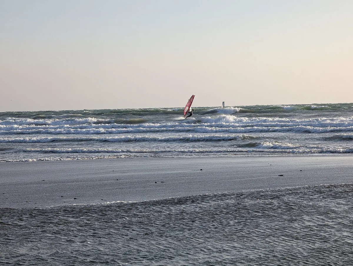Windy winter conditions on Yuigahama Beach in Kamakura