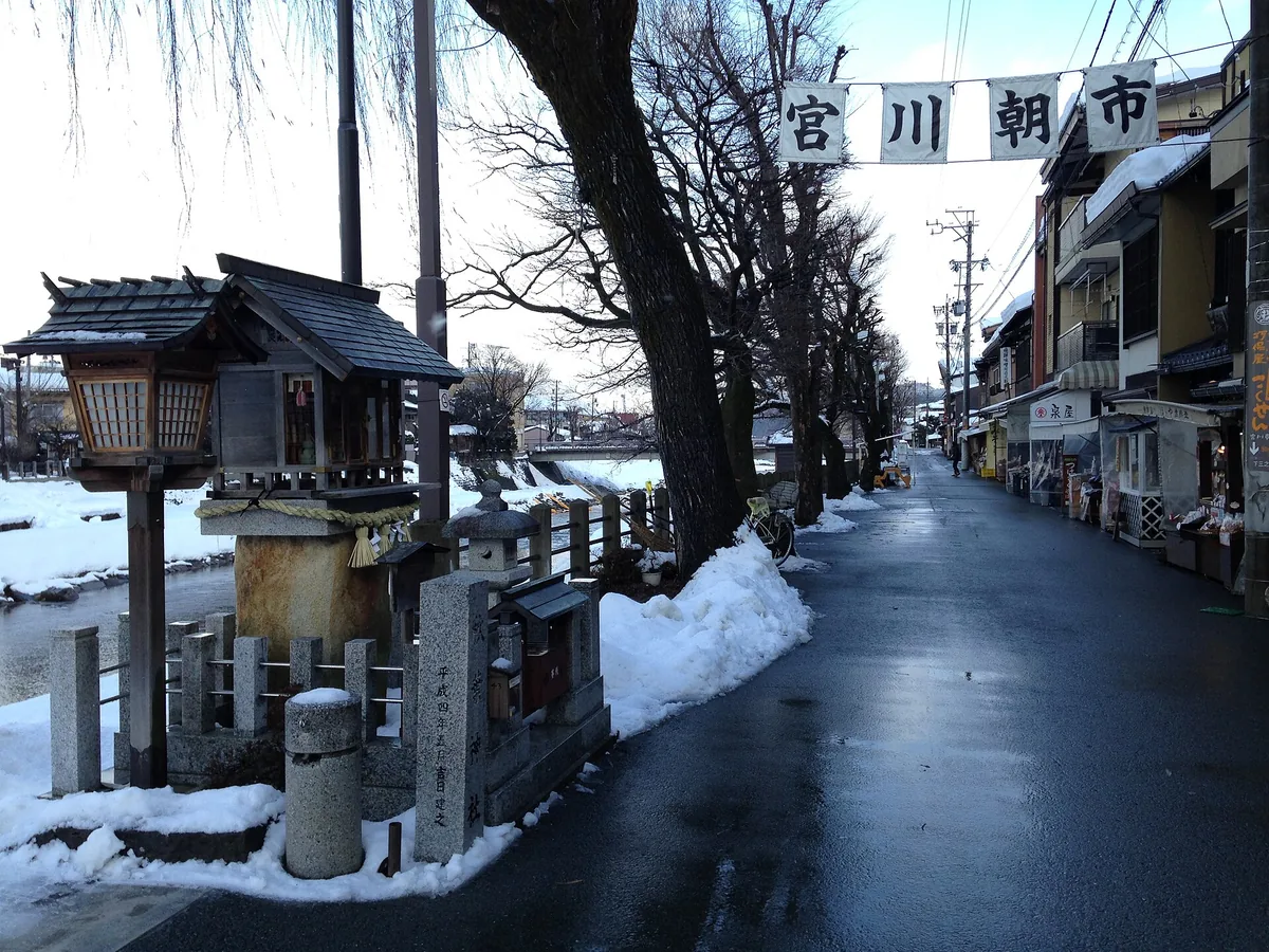 Snowy street through the Miyagawa Morning Market area in Takayama