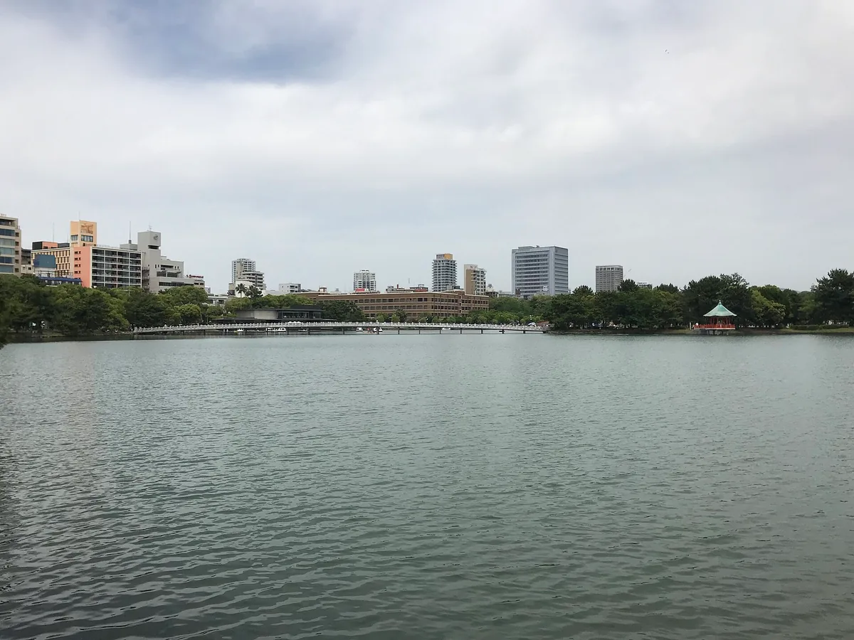 Kangetsubashi Bridge and Ukimido Hall reflected in Ohori Park pond