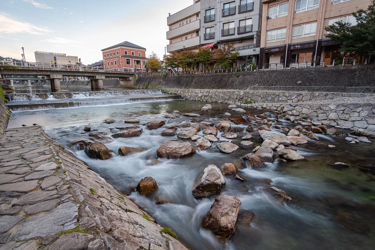 Miyagawa River flowing through central Takayama with mountains beyond