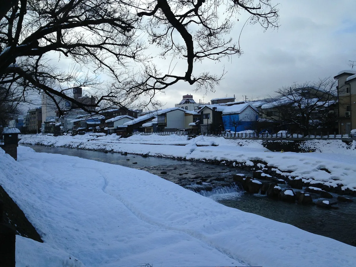 Snow along the Miyagawa River beside the morning market area in Takayama