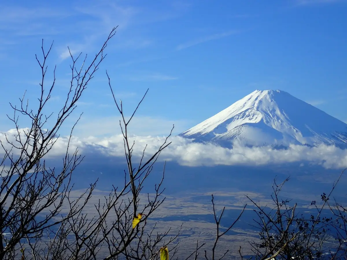 Snow-covered Mount Fuji seen from Hakone under a clear blue sky